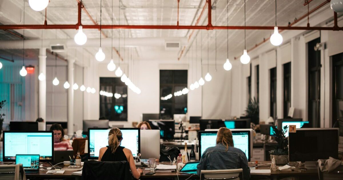 A photo of people working at office
